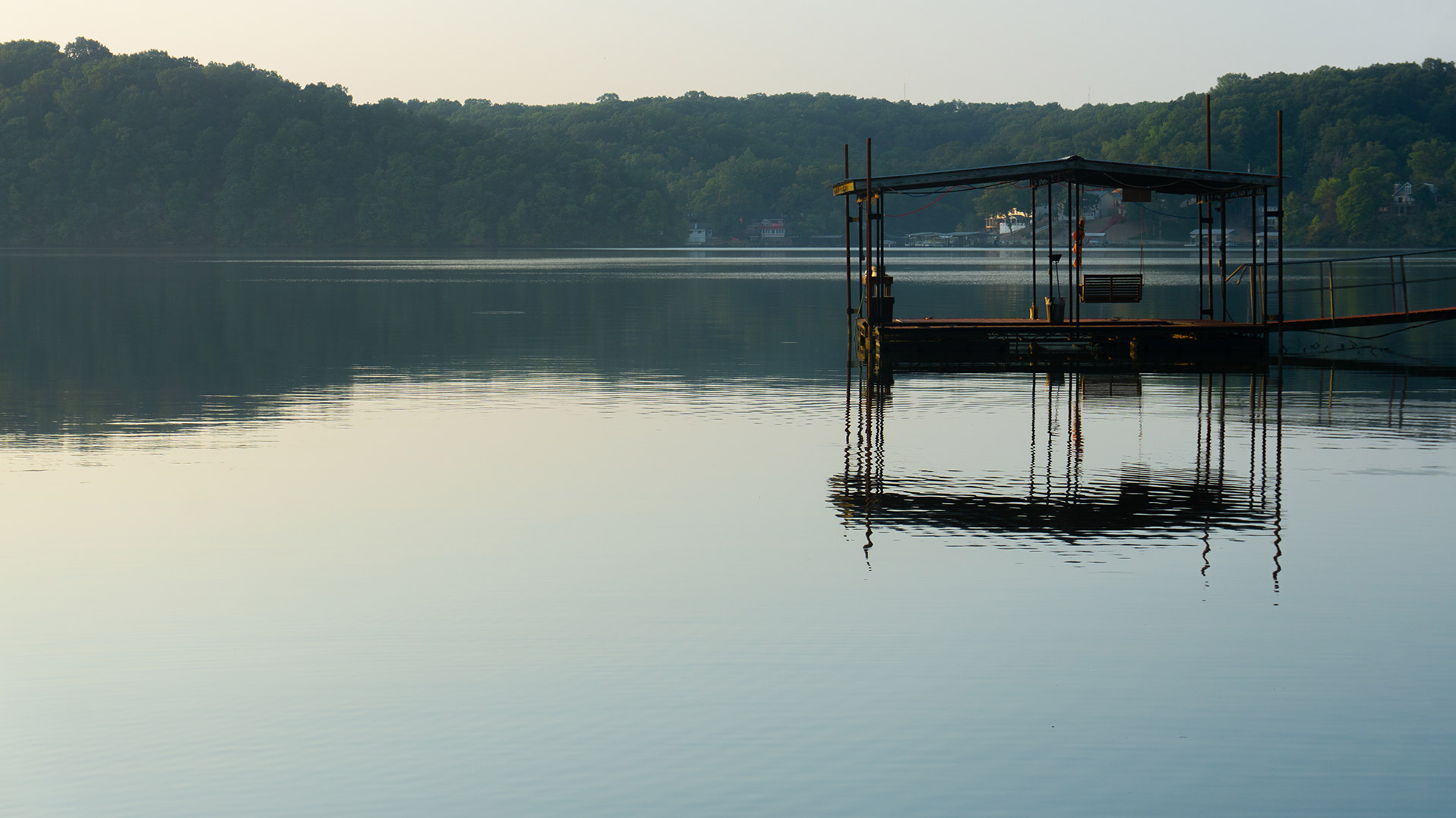 Dock on a lake during sunrise